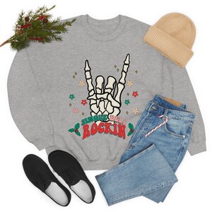 Jingle Bell Rockin Skeleton Unisex Heavy Blend Crewneck Sweatshirt