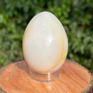 Elegant 65mm White Onyx Egg Crystal carving w/ iron inclusion formations