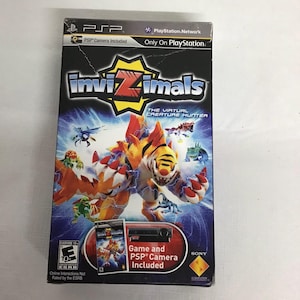 May include: A video game case for "Invizimals: The Virtual Creature Hunter" for the PSP. The cover features a colorful illustration of creatures and the game's title. Includes a PSP camera. Rated "Everyone 10+" by the ESRB.