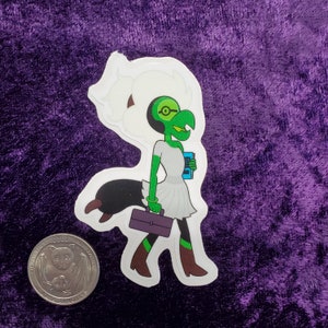 May include: A sticker featuring a cartoon character with a green head, arms, and legs, wearing a white dress and brown boots. The character is carrying a purple briefcase and a blue book. The sticker is on a purple background.