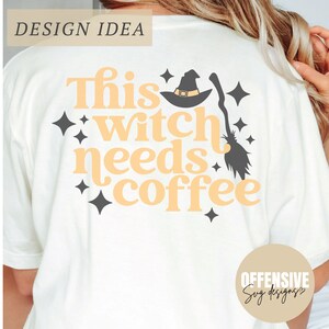 May include: A white t-shirt with the text "This witch needs coffee" in orange letters. A black witch hat with a broom is above the text. There are small black stars around the text.