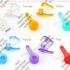 May include: A collection of colorful, transparent acrylic spoon-shaped charms. The charms are available in transparent, orange, green, blue, purple, and red. Each charm is approximately 18mm long and 8mm wide. The text "Jay's Glowforge Laser Blanks & More" is visible.
