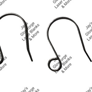 May include: Two black metal earring hooks. The hooks are made of a smooth, shiny metal. The hooks are designed to be used with earrings.