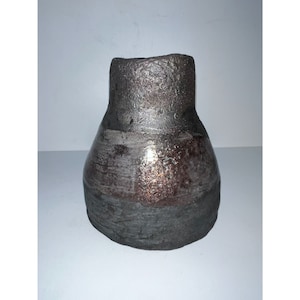 May include: A dark brown ceramic vase with a wide base and a narrow opening. The vase has a textured surface and a metallic sheen.