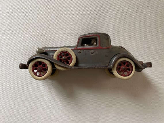 Arcade REO Rumble Seat Coupe Cast Iron Toy Car and Driver, With Side Mount  Spare Tires 