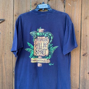 2002 Vintage “Trespassers will be offered a shot.” Margaritaville Jimmy Buffet Lizard T-shirt size Medium, Y2K, Streetwear, Urban Outfitters image 1