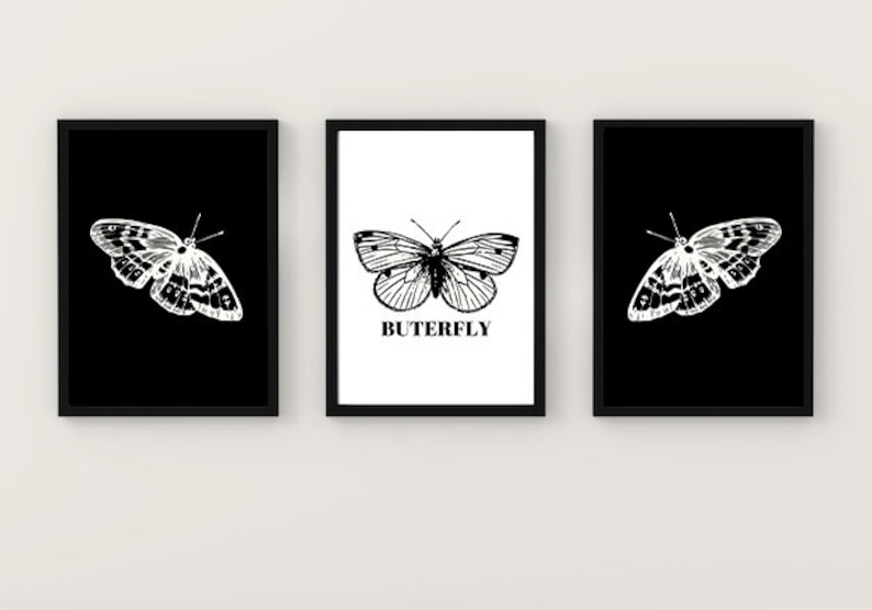 May include: Three black framed prints with white butterfly illustrations. The center print has the word "BUTTERFLY" in black text.