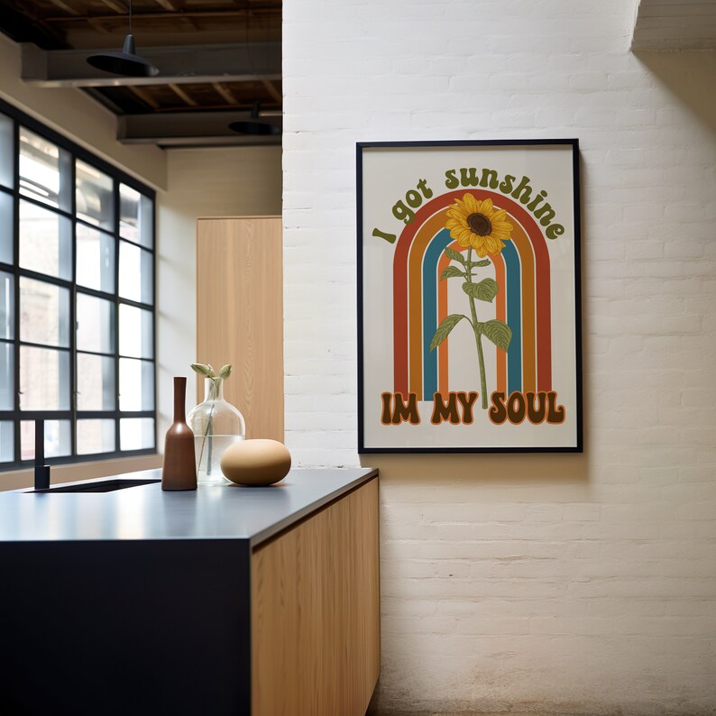 May include: A retro-style poster featuring a sunflower and rainbow design. The text on the poster reads "I got sunshine in my soul."