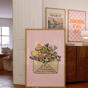 May include: A framed art print featuring a pink background with an illustration of colorful mushrooms and flowers emerging from an envelope. The text on the envelope reads "She has the soul of a Gypsy, The Heart of a Hippie, The Spirit of Fairy."