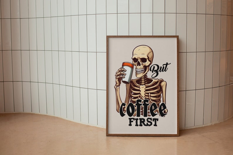 May include: A framed illustration of a skeleton holding a coffee cup with the text "But coffee first".
