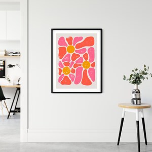 May include: Abstract art print with a pink, orange, and white color scheme. The print features a pattern of organic shapes and circles.