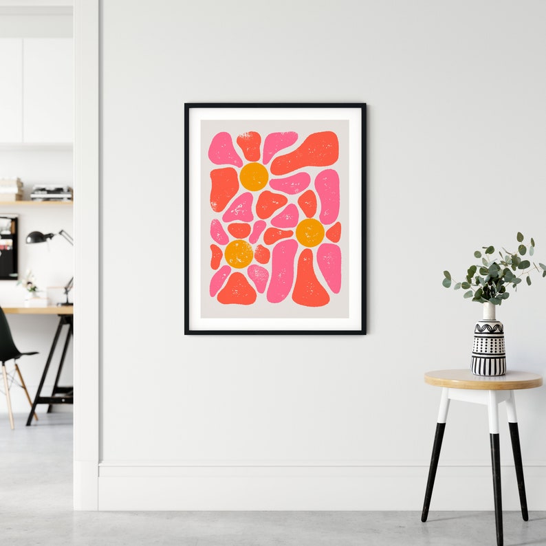 May include: Abstract art print with a pink, orange, and white color scheme. The print features a pattern of organic shapes and circles.