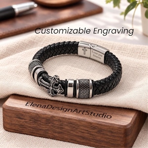May include: A black braided leather bracelet featuring silver-toned metal accents, a cross charm, and a clasp engraved with a cross and the text "Love you forever". The text "Customizable Engraving" and "ElenaDesignArtStudio" are visible.