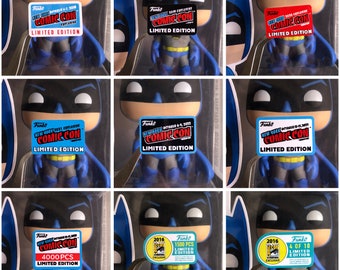 May include: Nine different versions of a Funko Pop! figure of Batman. Each figure is in a clear plastic box with a sticker on the front. The stickers are different colors and have different text. The text on the stickers includes "New York Comic Con", "Limited Edition", "4000 PCS", "1500 PCS", and "4 of 10".