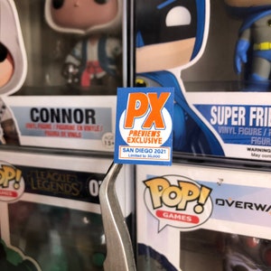 May include: A blue and orange sticker with the text "PX Previews Exclusive" and "San Diego 2021 Limited to 30,000".