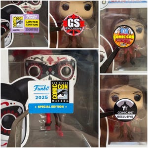 May include: A selection of Funko Pop vinyl figures in their packaging. The figures have different designs, including a Day of the Dead-themed character and others with Comic Con and exclusive edition stickers. The figures are in clear plastic boxes.