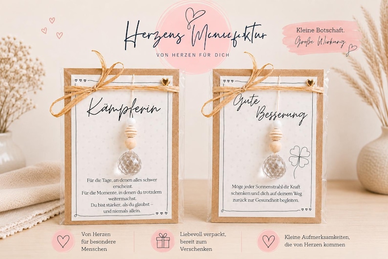 May include: Two rectangular kraft paper cards in clear plastic sleeves, each featuring a hanging clear faceted glass bead, wooden beads, and a jute twine bow. The cards display German text, including the words K&auml;mpferin and Gute Besserung.