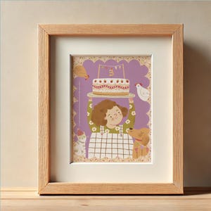 May include: A framed illustration featuring a child holding a birthday cake. The image has a purple background with a scalloped edge. A cat, dog, and chickens are also depicted. The frame is made of light-colored wood.