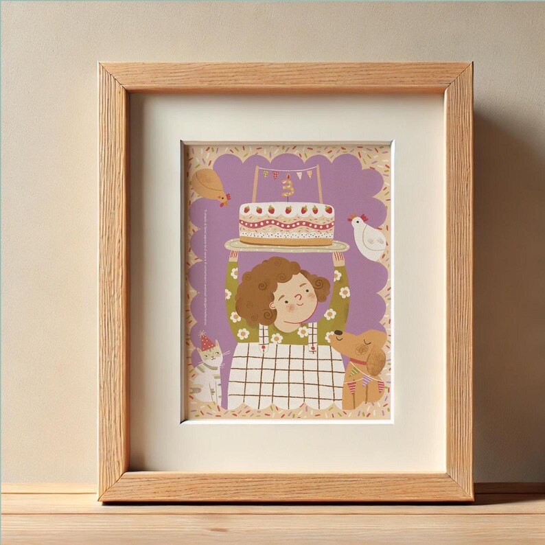 May include: A framed illustration featuring a child holding a birthday cake. The image has a purple background with a scalloped edge. A cat, dog, and chickens are also depicted. The frame is made of light-colored wood.