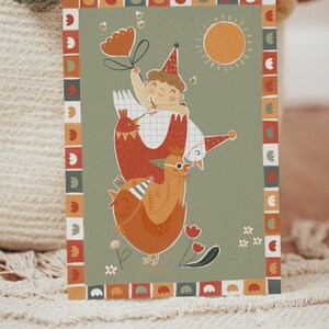 May include: A whimsical illustration on a card features a child atop three chickens, holding a flower-shaped balloon. The design includes a sun, bees, and floral elements, framed by a decorative border. The color palette includes orange, red, and green.