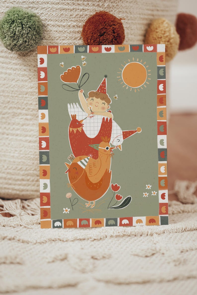 May include: A whimsical illustration on a card features a child atop three chickens, holding a flower-shaped balloon. The design includes a sun, bees, and floral elements, framed by a decorative border. The color palette includes orange, red, and green.