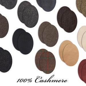 May include: A selection of circular fabric patches in diverse shades and textures, such as grey, brown, black, and tartan. The words "100% Cashmere" are printed at the bottom, denoting the material composition.