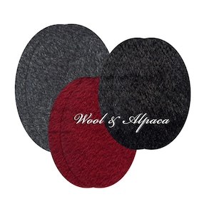 May include: Three oval-shaped fabric patches in dark gray, deep red, and black. The patches have a textured, felt-like appearance. The text "Wool & Alpaca" is printed in white cursive script across the center of the overlapping patches.