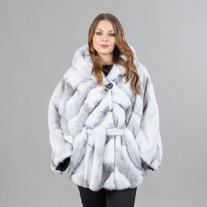 Mink fur cape with a hood in black and white color