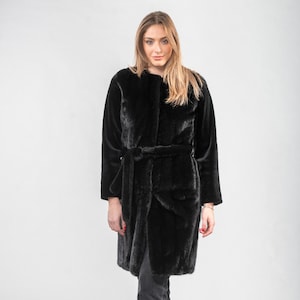 Mink fur coat with a belt in black color