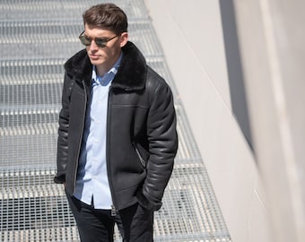 Real sheepskin jacket in black color with a sheepskin fur collar