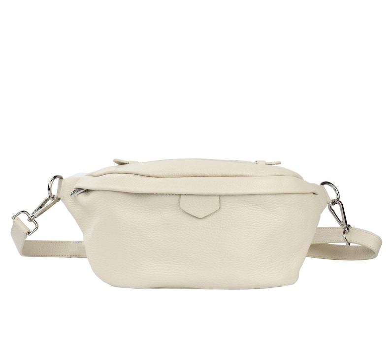 May include: A cream-colored leather fanny pack with a silver buckle and adjustable strap.