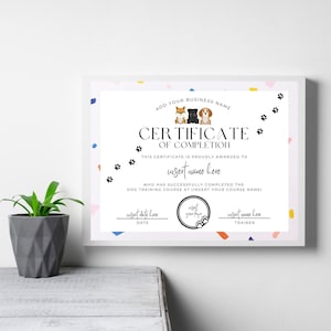 May include: A printable certificate of completion for a dog training course. The certificate features a colorful design with paw prints and a cartoon image of three dogs. The text on the certificate reads "Certificate of Completion" and includes space to insert the name of the recipient, the date, and the name of the trainer.