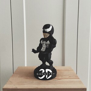 Personalized Marvel Venom controller stand, a unique anniversary or Valentine’s gift for him. Customize it for the ultimate gaming setup and superhero fan.
