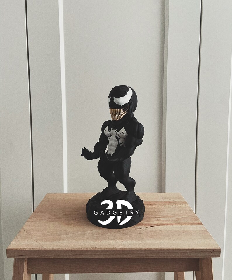 Personalized Marvel Venom controller stand, a unique anniversary or Valentine’s gift for him. Customize it for the ultimate gaming setup and superhero fan.
