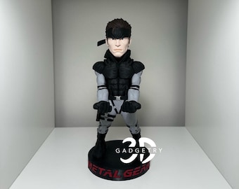 Soporte para mando de Solid Snake: decoración para fans de Metal Gear. Soporte personalizado para juegos, regalo y accesorio para gamers.