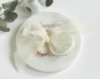 Ring disc/ring cushion made of marble, calligraphed by hand with silk ribbon and shimmering ink