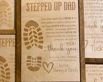 May include: A wooden sign with the text "Stepped Up Dad" and a heart design. The sign includes the text "one who made the choice to love another's child as their own. One who steps up to provide, protect, encourage and love. You may not have given me the gift of life but you have given me the gift of... You. Thank you for being the father you didn't have to be. Love, Danny & Cindy."