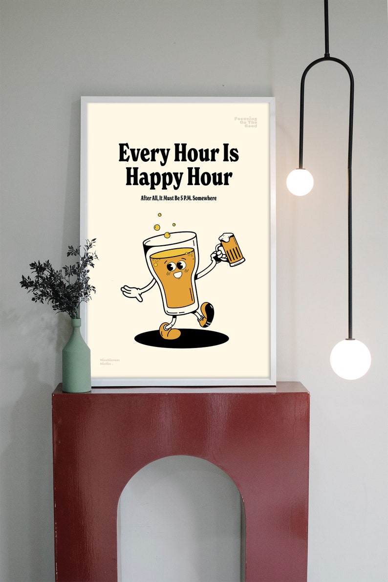 May include: A framed print with the text "Every Hour Is Happy Hour" and a cartoon beer character holding a mug. The print has a cream background and is displayed on a red shelf.