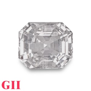 May include: A clear, rectangular-cut gemstone with multiple facets, reflecting light. The gem is set against a white background. The letters "GII" are printed in red at the bottom left.
