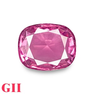 May include: A pink oval-shaped gemstone with a faceted cut. The gemstone is set against a white background.