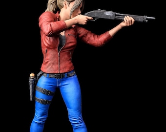 May include: A collectible figurine of a character with a ponytail, wearing a red jacket, blue jeans, and tan boots. The figure is in a dynamic pose, aiming a black shotgun forward. A black holster is attached to the belt, and the figure stands on a round black base.