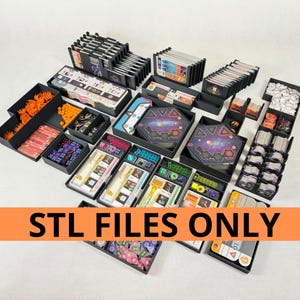 May include: A collection of black game organizers filled with various game components, including cards, dice, and tokens. The organizers are arranged on a white surface. The text "STL FILES ONLY" is displayed on an orange banner.