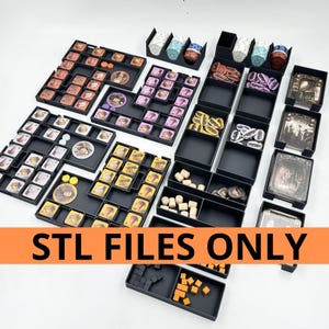 May include: A collection of black game organizers filled with game pieces, cards, and tokens. The organizers are arranged on a white surface. The image includes the text "STL FILES ONLY" in an orange banner.