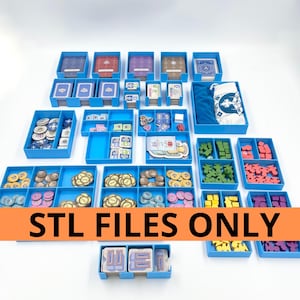 May include: A selection of blue game organisers filled with game components such as cards, tokens, and wooden pieces. The text "STL FILES ONLY" is displayed on an orange banner.