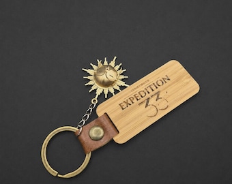Esquie Chiaroscuro Expedition 33 Keychain | Gamer Accessory | Geek Gift | RPG Keychain | Fan Art Collection
