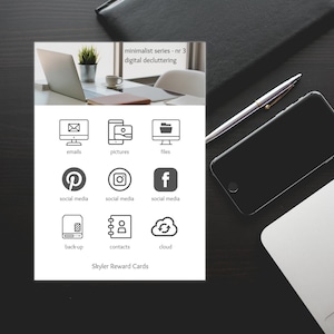 May include: A printable digital decluttering reward chart with icons for emails, pictures, files, social media, back-up, contacts, and cloud storage. The chart is titled "minimalist series - nr 3 digital decluttering" and "Skyler Reward Cards".