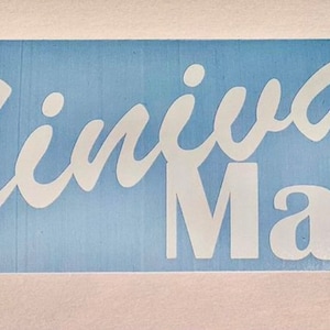May include: White vinyl decal with the text "Minivan Mafia" in a cursive font on a light blue background.