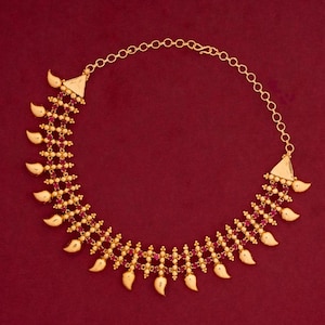 May include: A white ceramic mug with a black handle and the text "But First, Coffee" in a handwritten style. The mug is on a white surface. The mug is 4 inches tall.