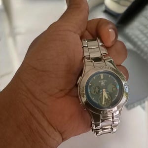 Fossil BQ-9069 diver watch for men featuring a 39mm stainless steel case, analog and digital quartz movement, and sapphire blue dial with luminous markers. Vintage style with 100m water resistance. Great gift for watch enthusiasts or classic accessory collectors.
