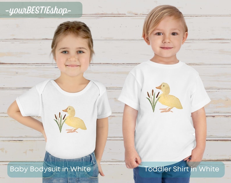 May include: White baby bodysuit and toddler shirt with a yellow duckling illustration and green reeds. The text "yourBESTIEshop" is at the top of the image.